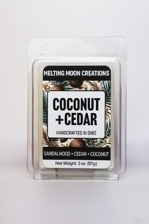Coconut + Cedar wax melt sitting on white backdrop. Label designed by Melting Moon Creations.
