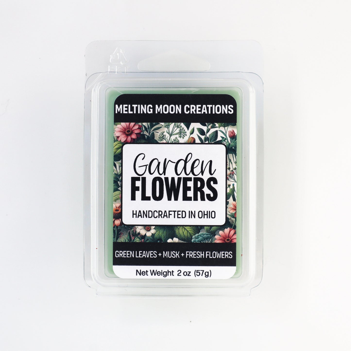 Garden Flowers wax melt sitting on white backdrop. Label designed by Melting Moon Creations.