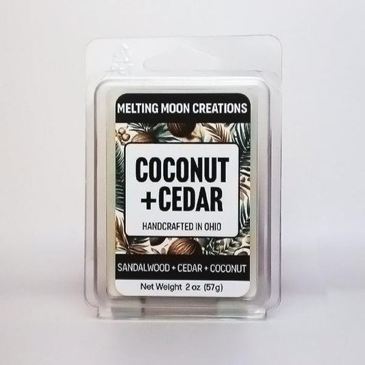 Coconut + Cedar wax melt sitting on white backdrop. Label designed by Melting Moon Creations.