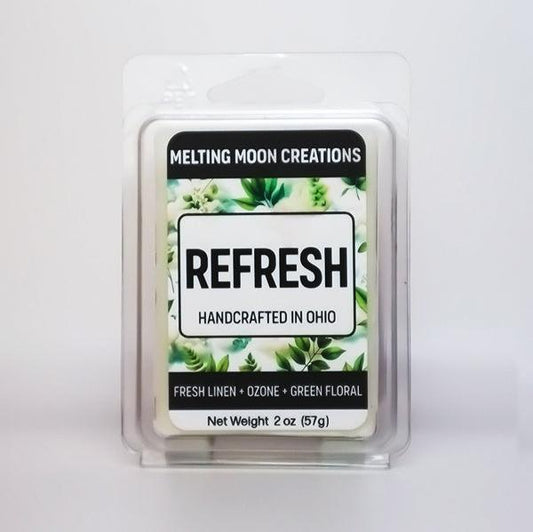 Refresh wax melt sitting on white backdrop. Label designed by Melting Moon Creations.