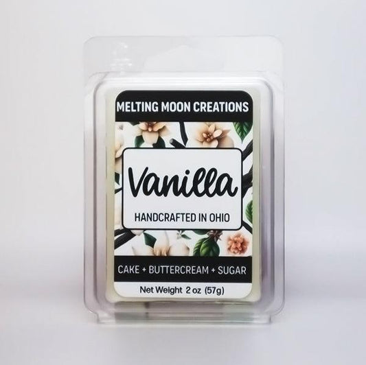 Vanilla wax melt sitting on white backdrop. Label designed by Melting Moon Creations.