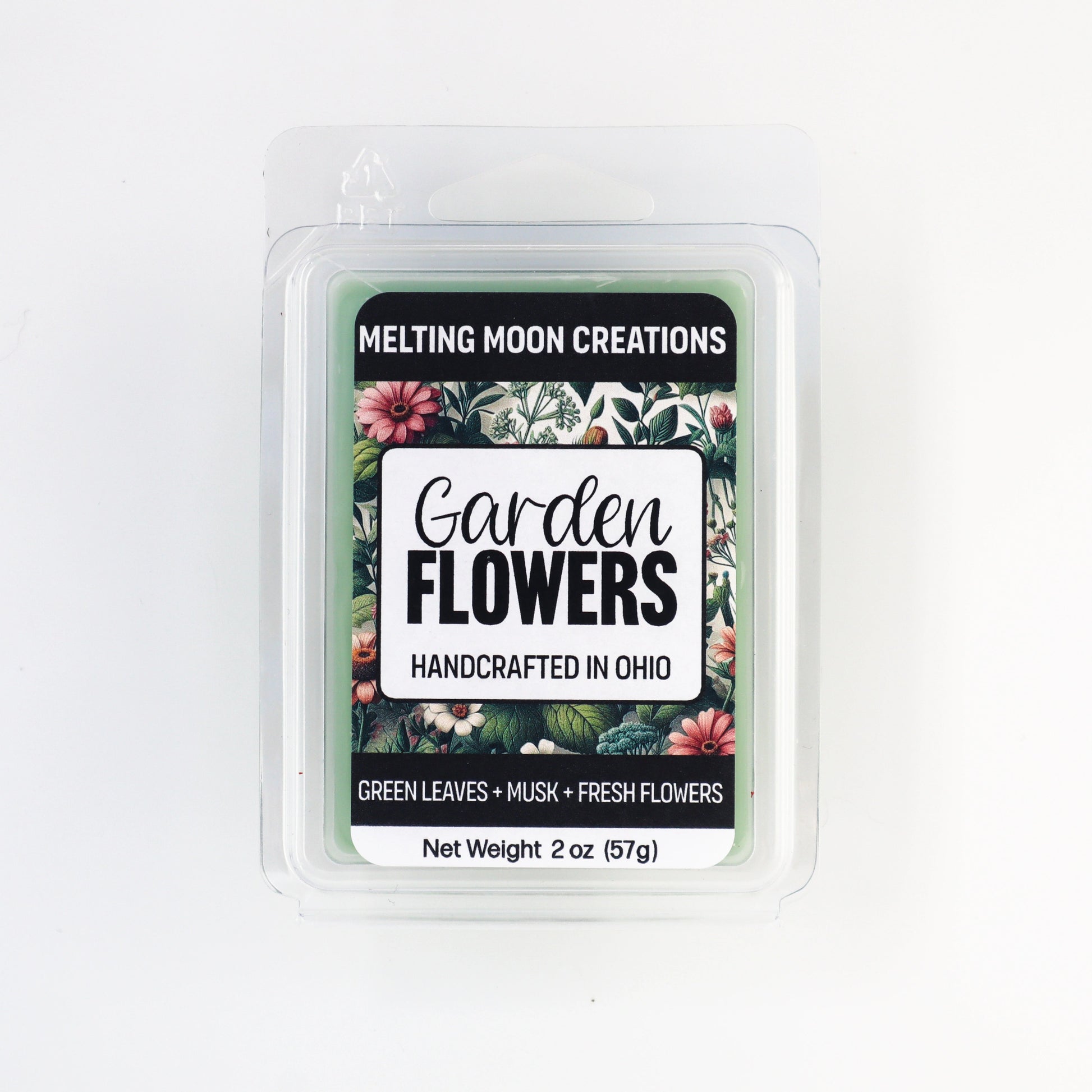 Garden Flowers wax melt sitting on white backdrop. Label designed by Melting Moon Creations. 